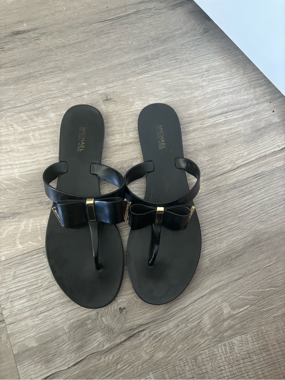 Michael Kors Black Bow Thong Sandals with Gold Accent